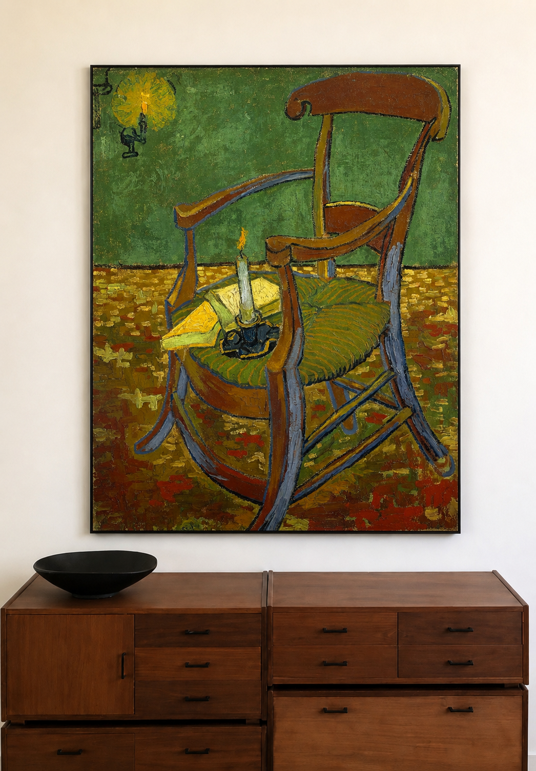 A framed painting of a rocking chair in a stylized, textured post-impressionist style, displayed on a white wall above a mid-century modern wooden dresser.